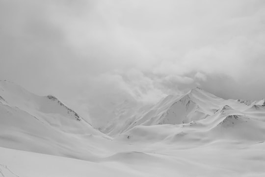 grayscale photo of mountains covered by snow in Tyrol Austria