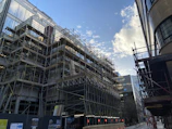 Wide shot of a large scaffolding setup surrounding a building under construction.