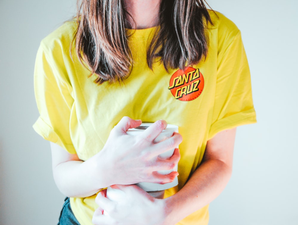 woman in yellow crew neck t-shirt