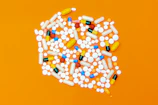 white and orange medication pill