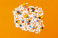 white and orange medication pill