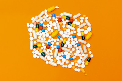 white and orange medication pill