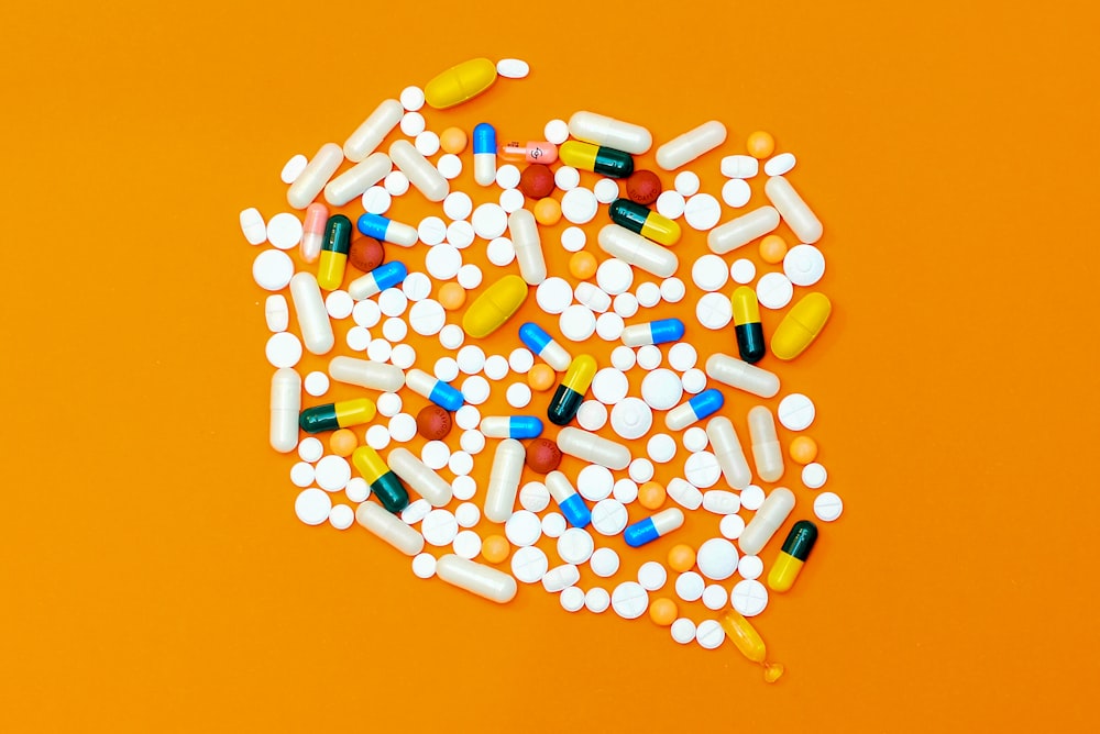 white and orange medication pill