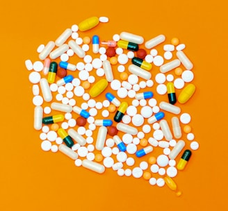 white and orange medication pill