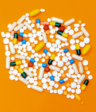 white and orange medication pill
