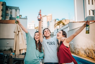 3 women and 2 men smiling