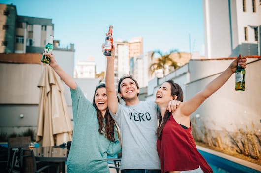 3 women and 2 men smiling