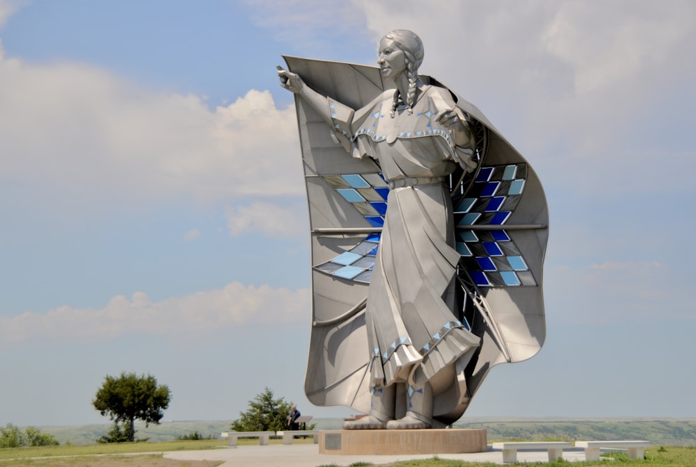 man in white and blue dress shirt statue