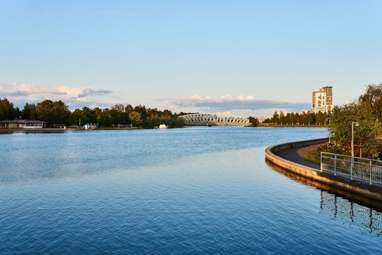 body of water near trees during daytime in Oulu Finland