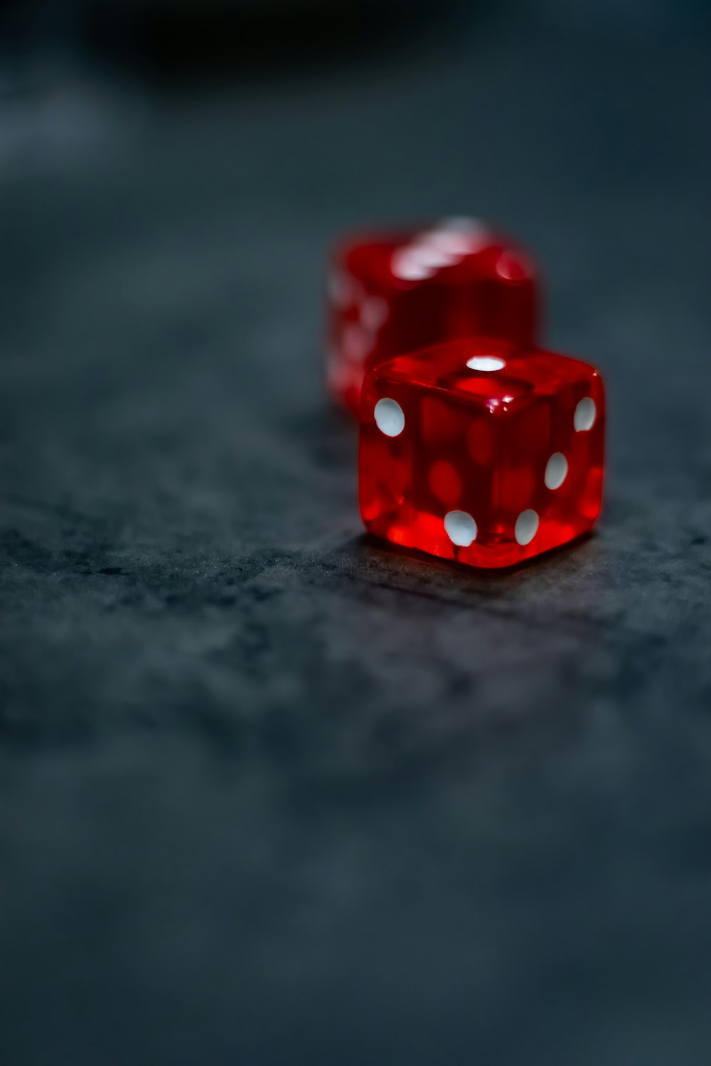 red and white dice on black surface