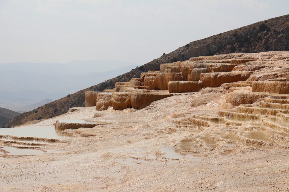 brown rocky mountain under white sky during daytime