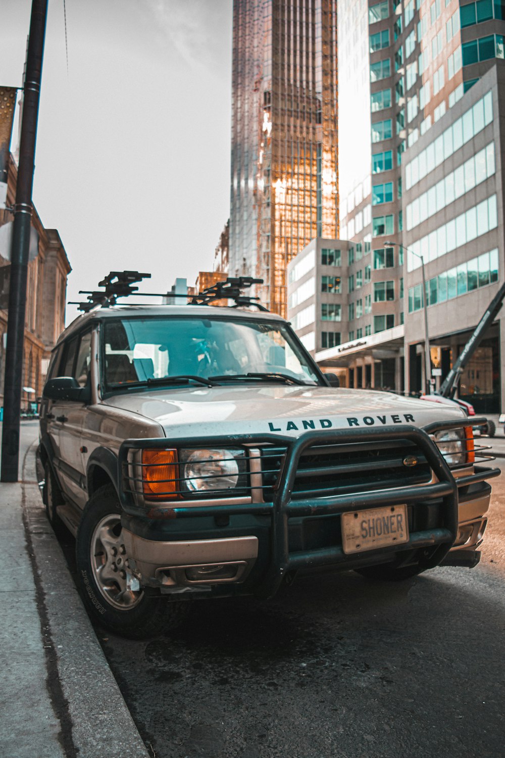 silver mercedes benz suv on road during daytime