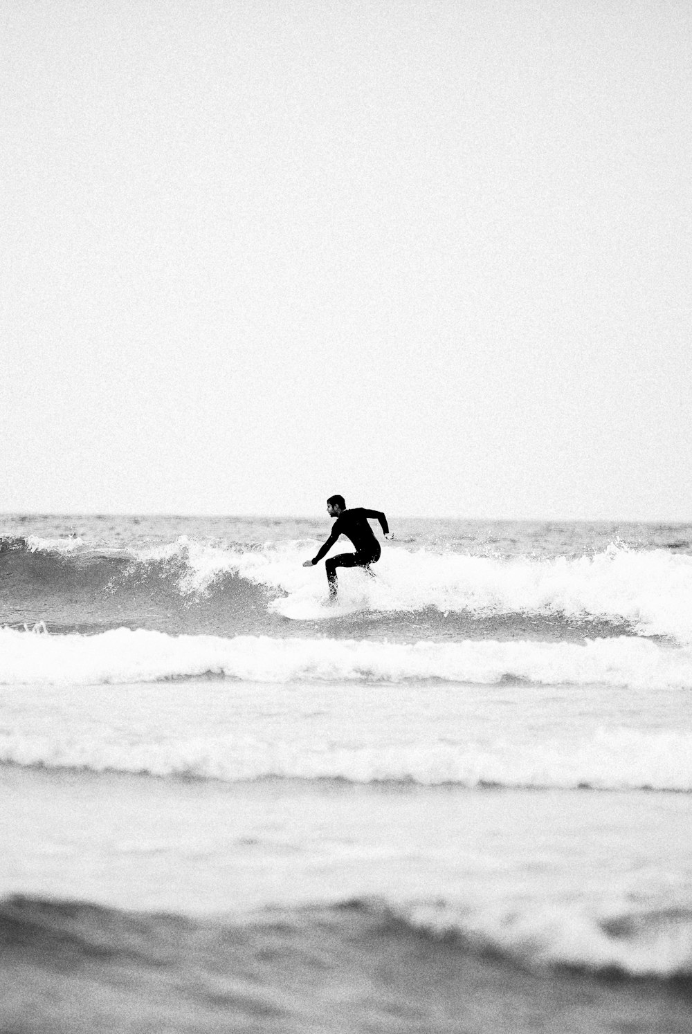 man surfing on sea waves