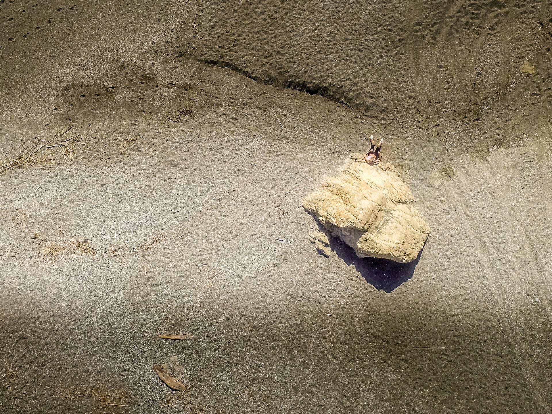 white stone on gray sand