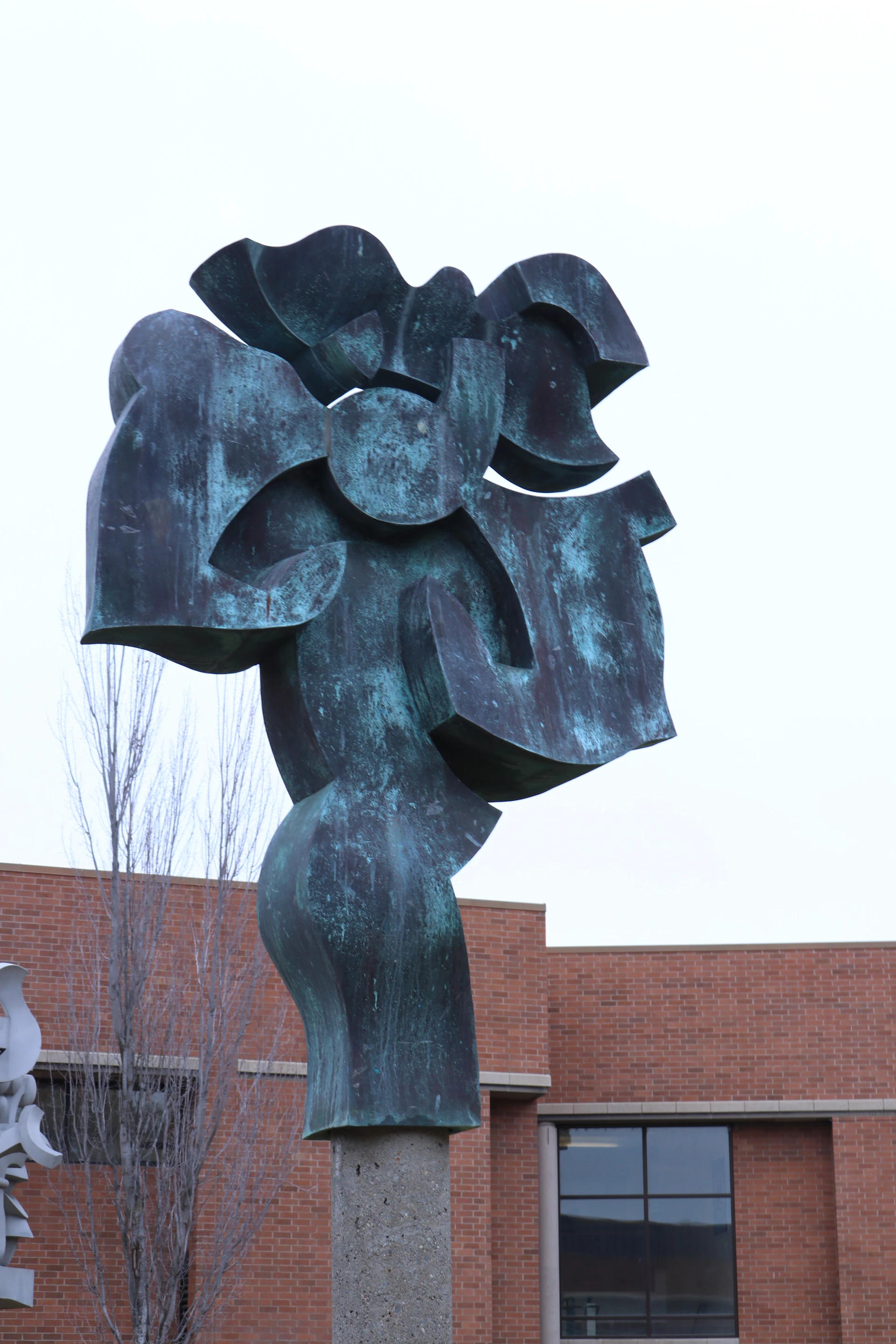 An abstract bronze sculpture with visible signs of heating and molding, capturing the raw energy of the material's transformation.