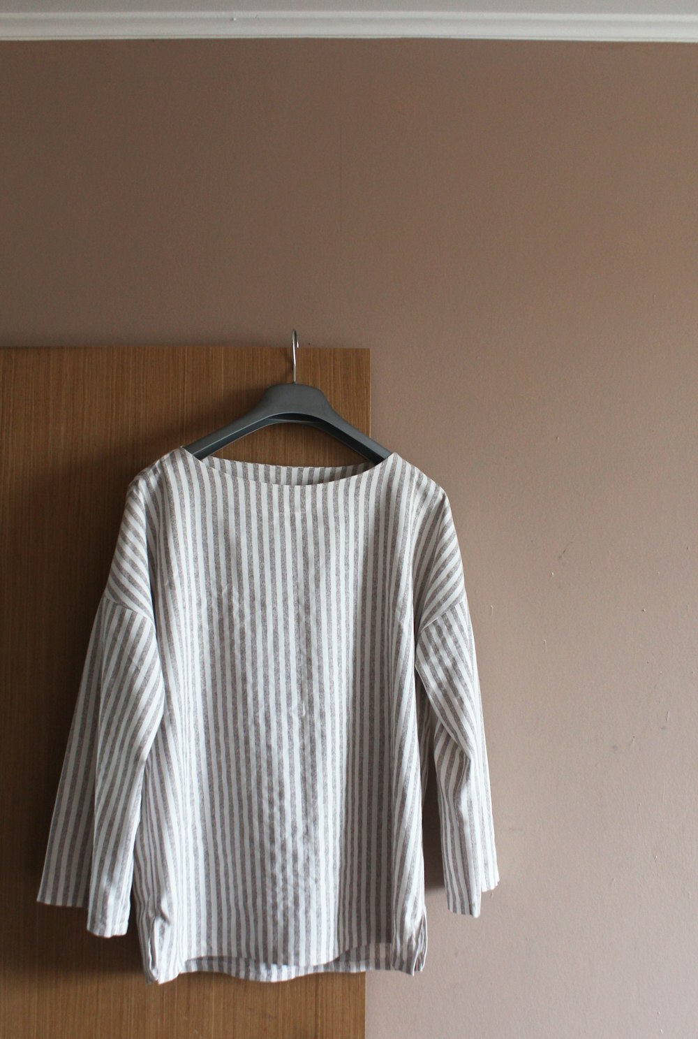 white and black striped long sleeve shirt