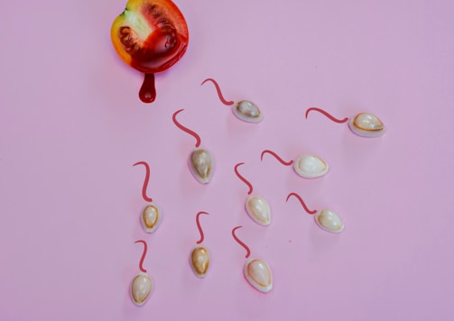 red and silver baubles on pink surface