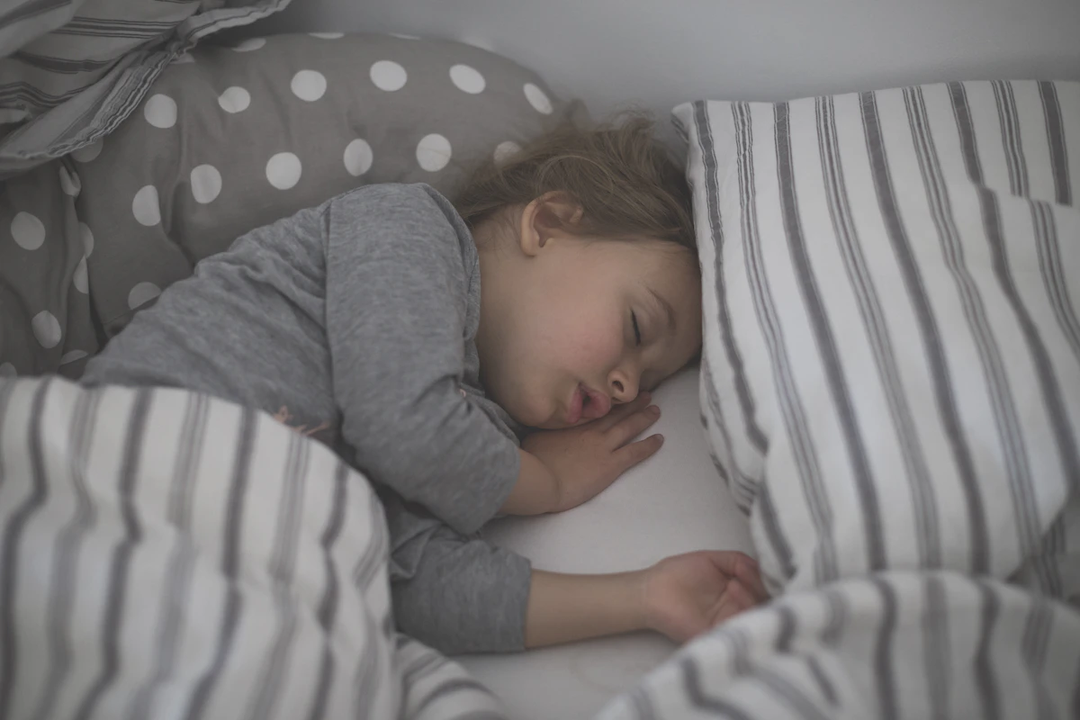Parent calming child during bedtime meltdown