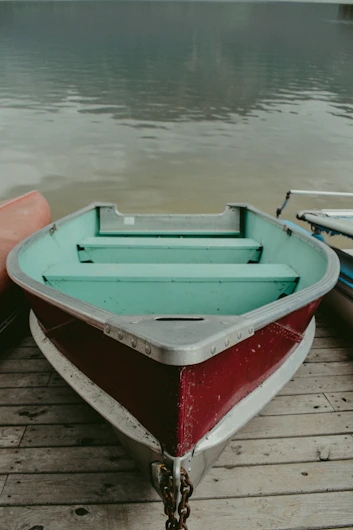 blue and red boat on water