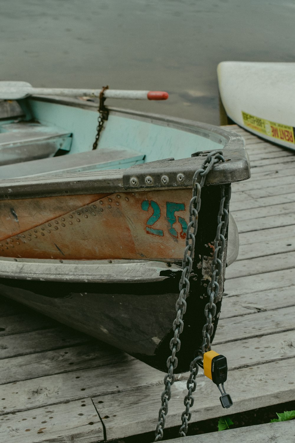 brown and white boat on wooden dock during daytime