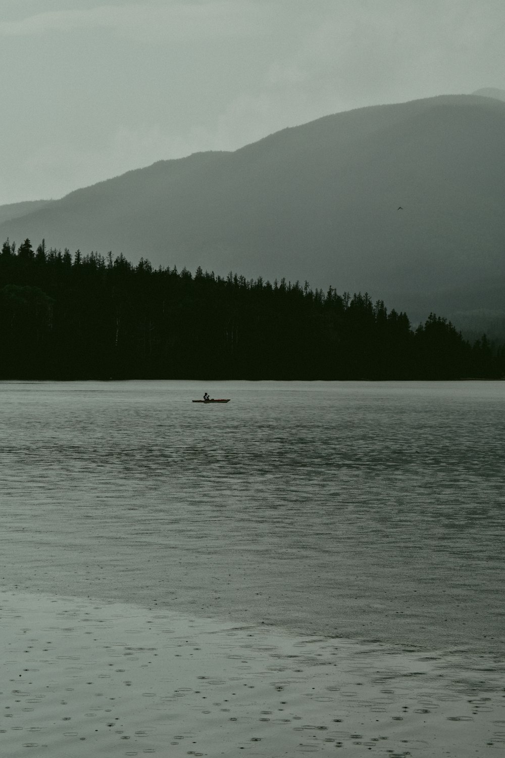 person riding on boat on sea during daytime