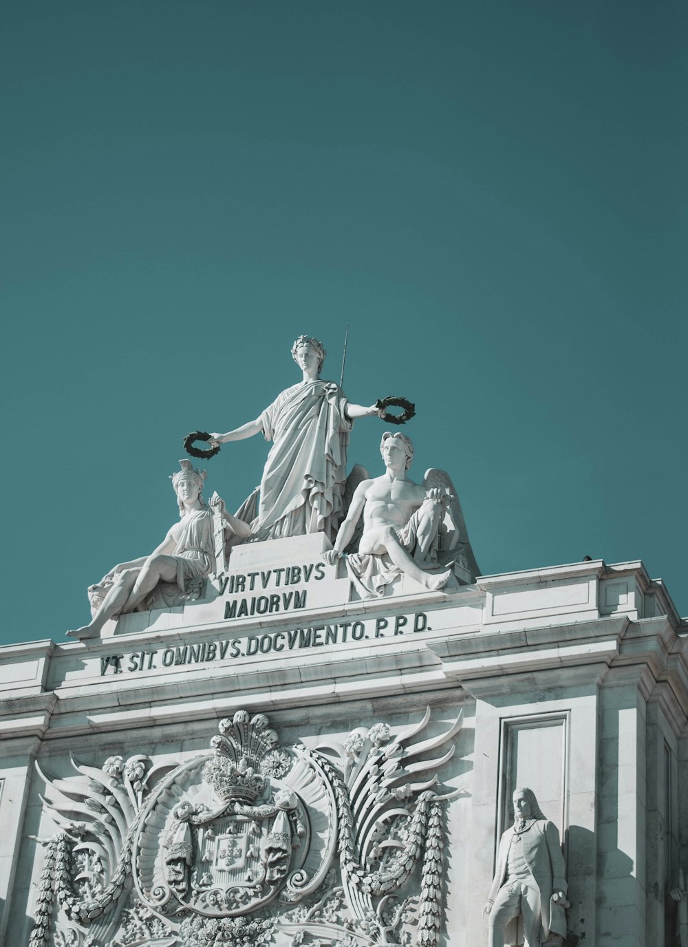 man riding horse statue under blue sky during daytime