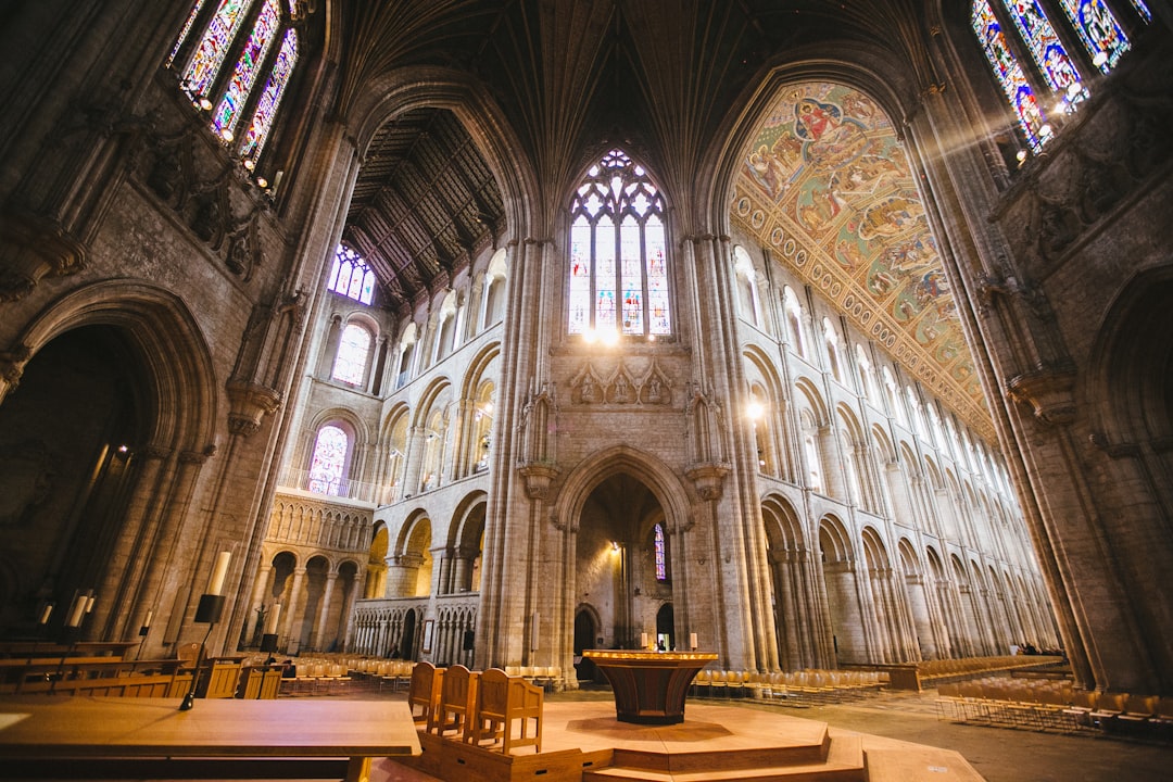 brown wooden chairs inside cathedral