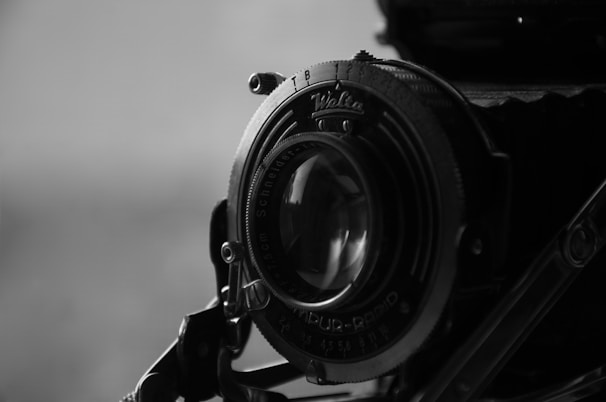 Close-up of a unique, handcrafted camera lens with intricate engravings.