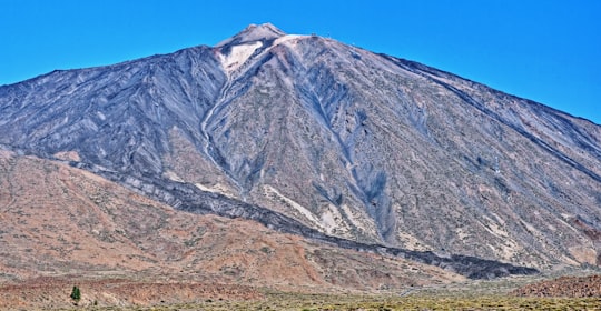 gray mountain under blue sky during daytime in Tenerife Spain