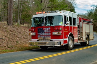 red and white fire truck on road during daytime
