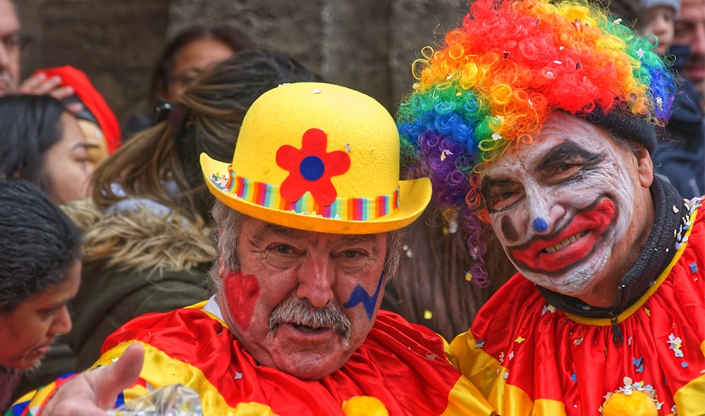 man in yellow orange and blue wig