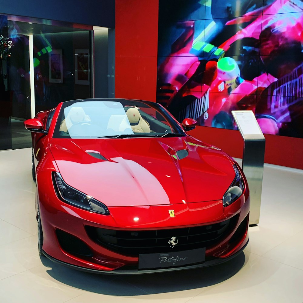 red ferrari sports car in a room