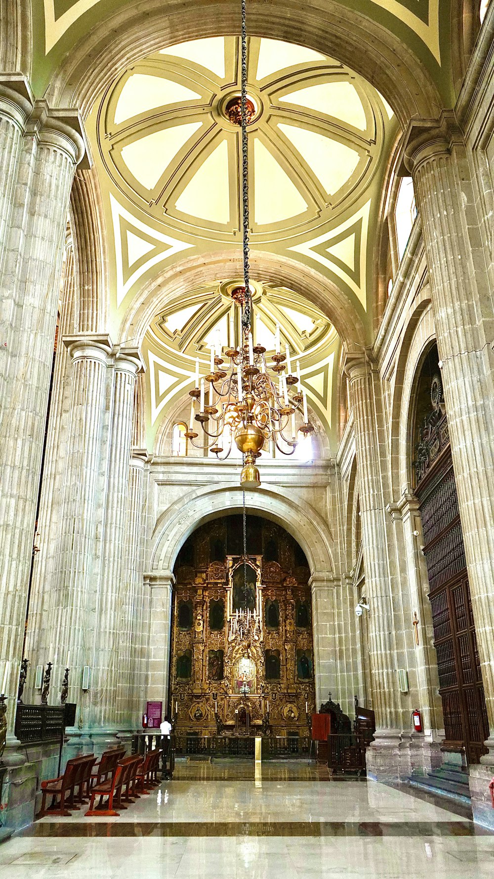 gold chandelier on white ceiling