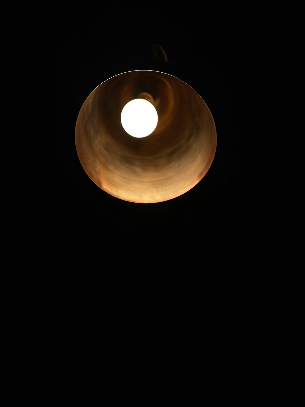 round brown light in dark room