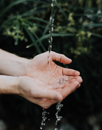 water drop on persons hand