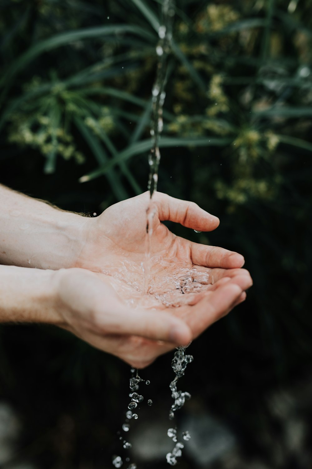 water drop on persons hand