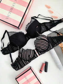 black lace brassiere on white table