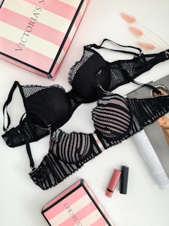 black lace brassiere on white table