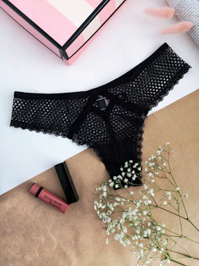 black and white polka dot panty on white table