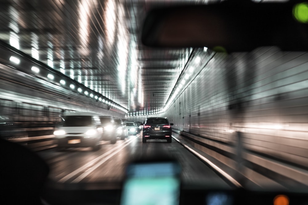 white and black car on road