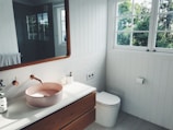 white ceramic sink with stainless steel faucet
