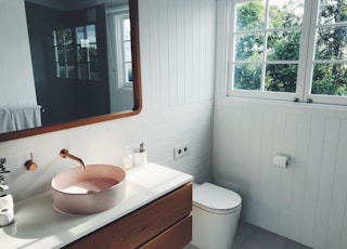 white ceramic sink with stainless steel faucet