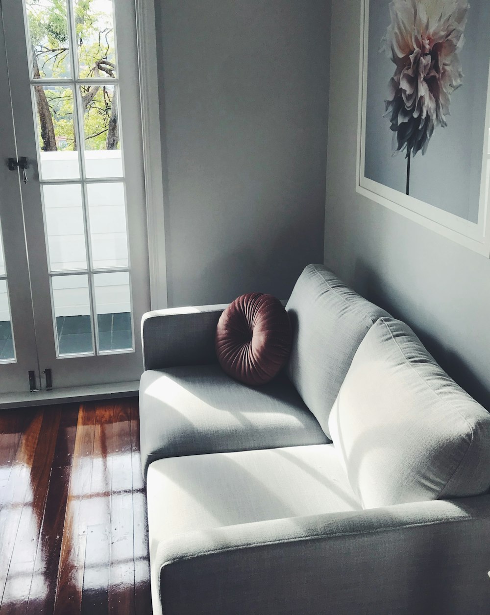 orange throw pillow on white couch