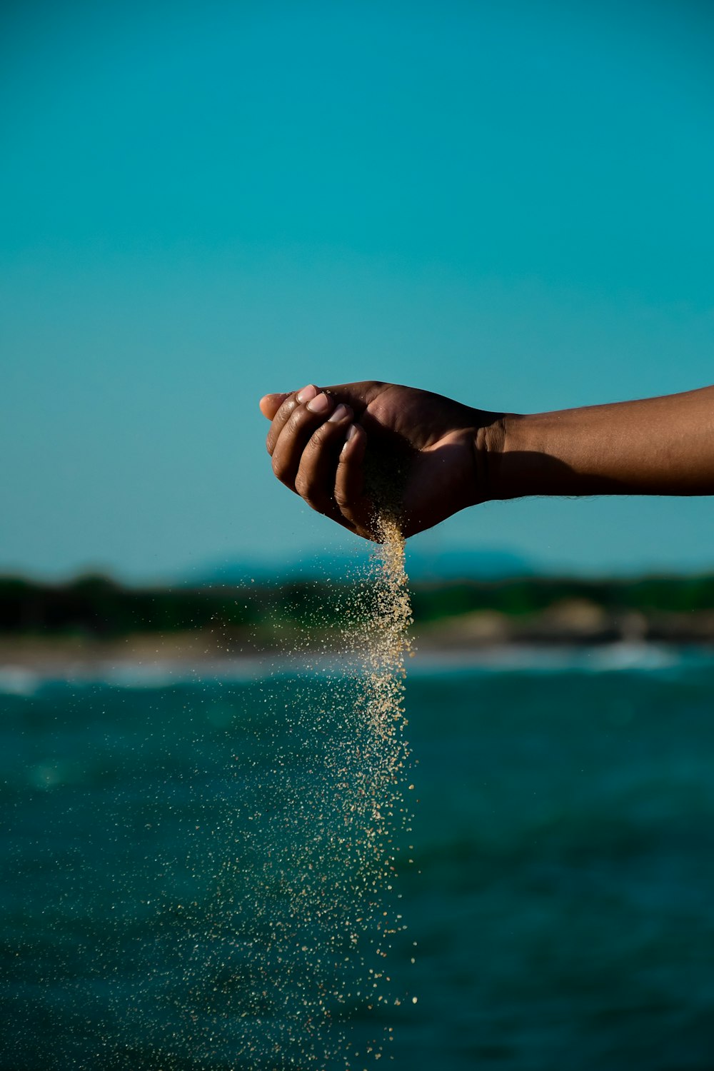 persons hand on water