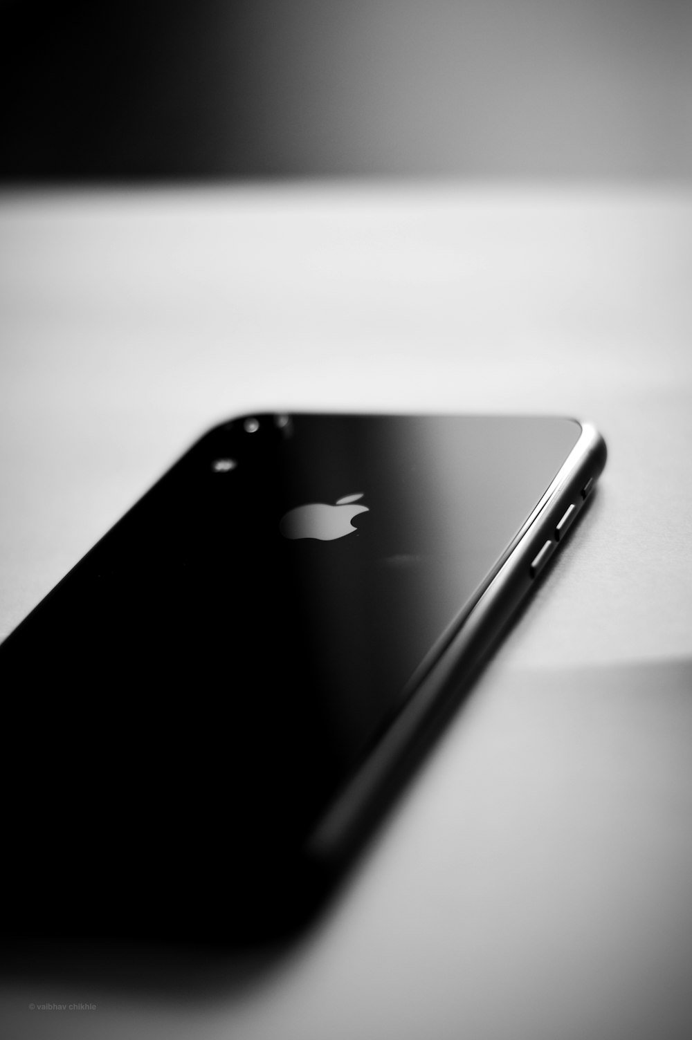 black iphone 7 on white table