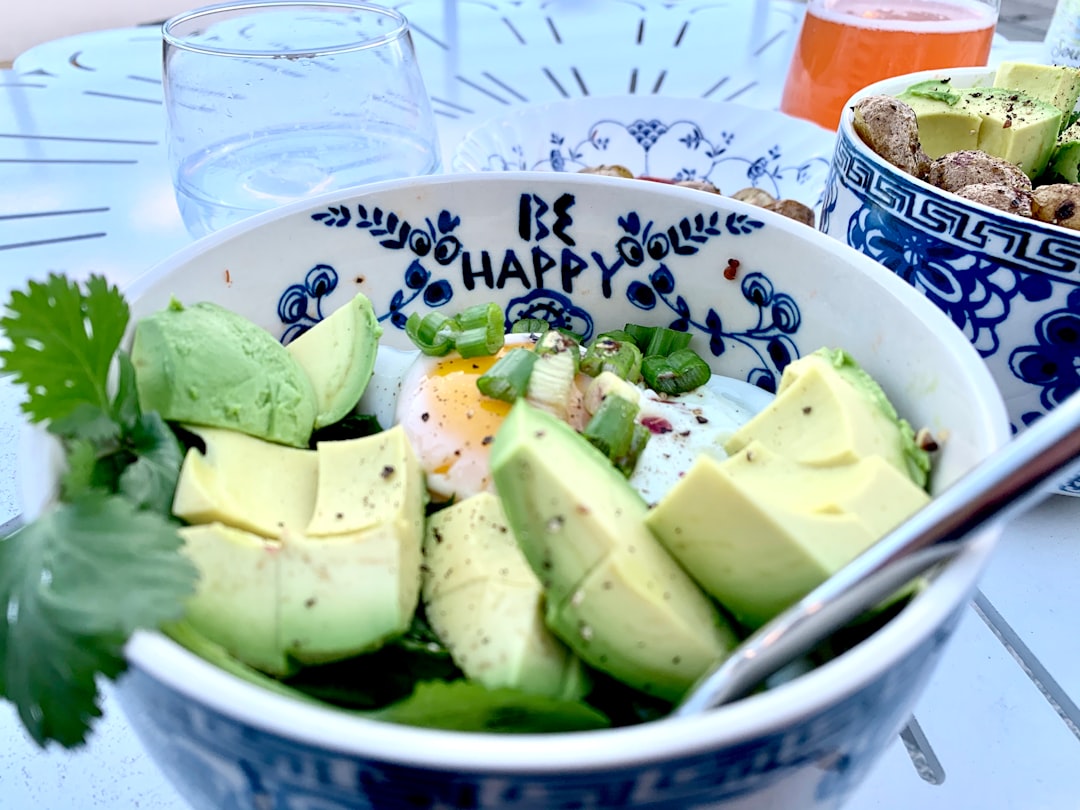 Bowl of avocado and an egg. 