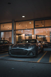 black porsche 911 parked in a parking lot