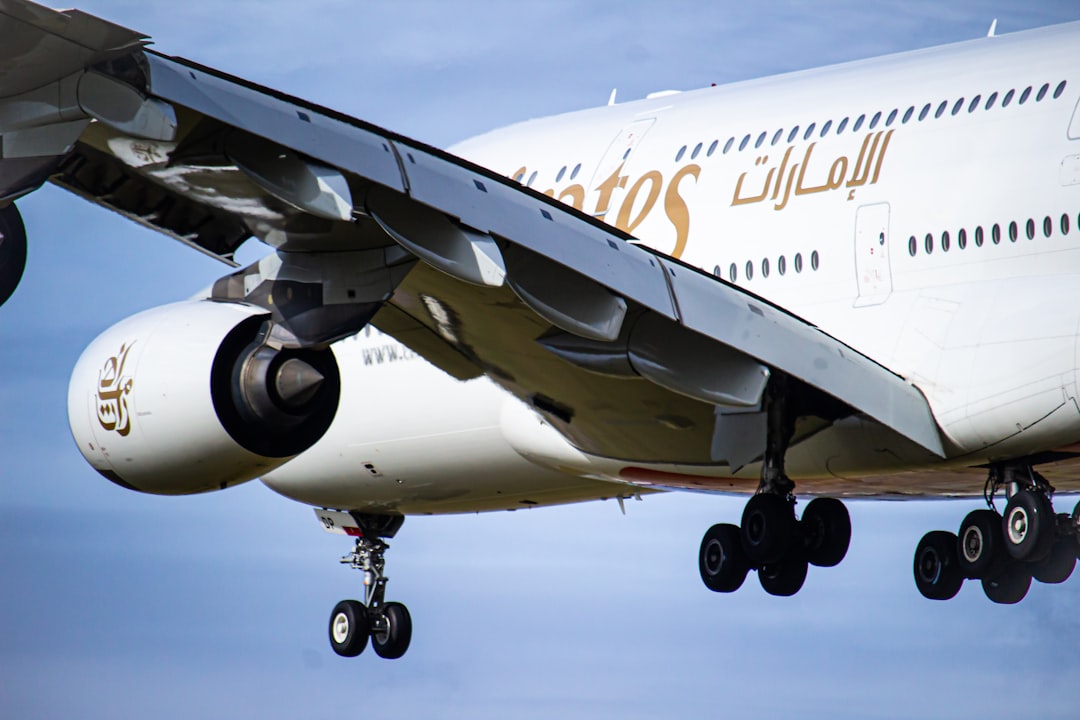 white and blue airplane on the sky, Emirates A380 on final into Heathrow 27L
