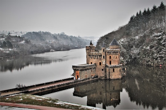 brown concrete building near body of water during daytime in Loire France