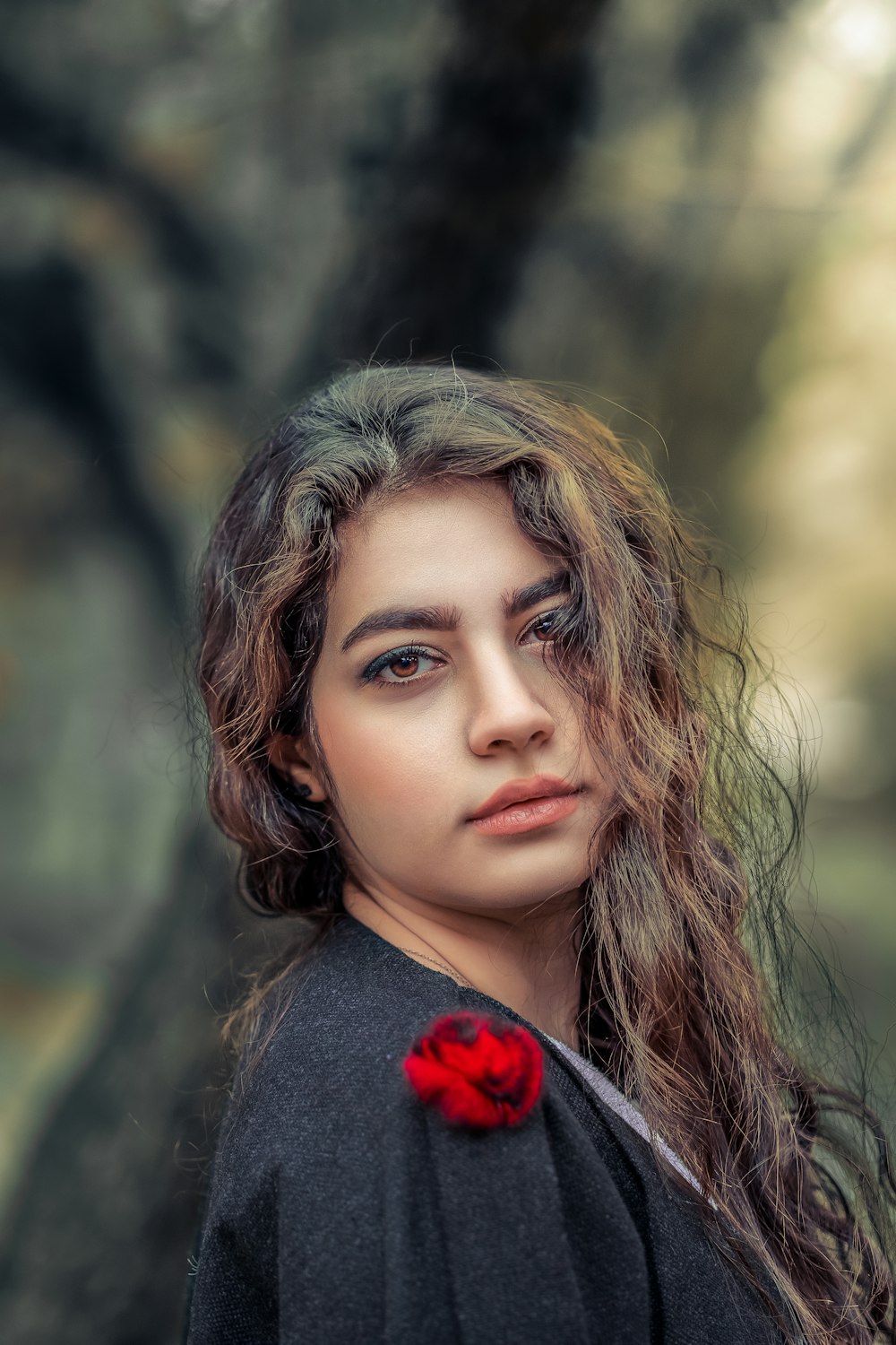 woman in red and black shirt